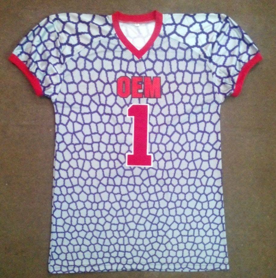 Original archived football jersey sample with blue pattern, red trim and number 1