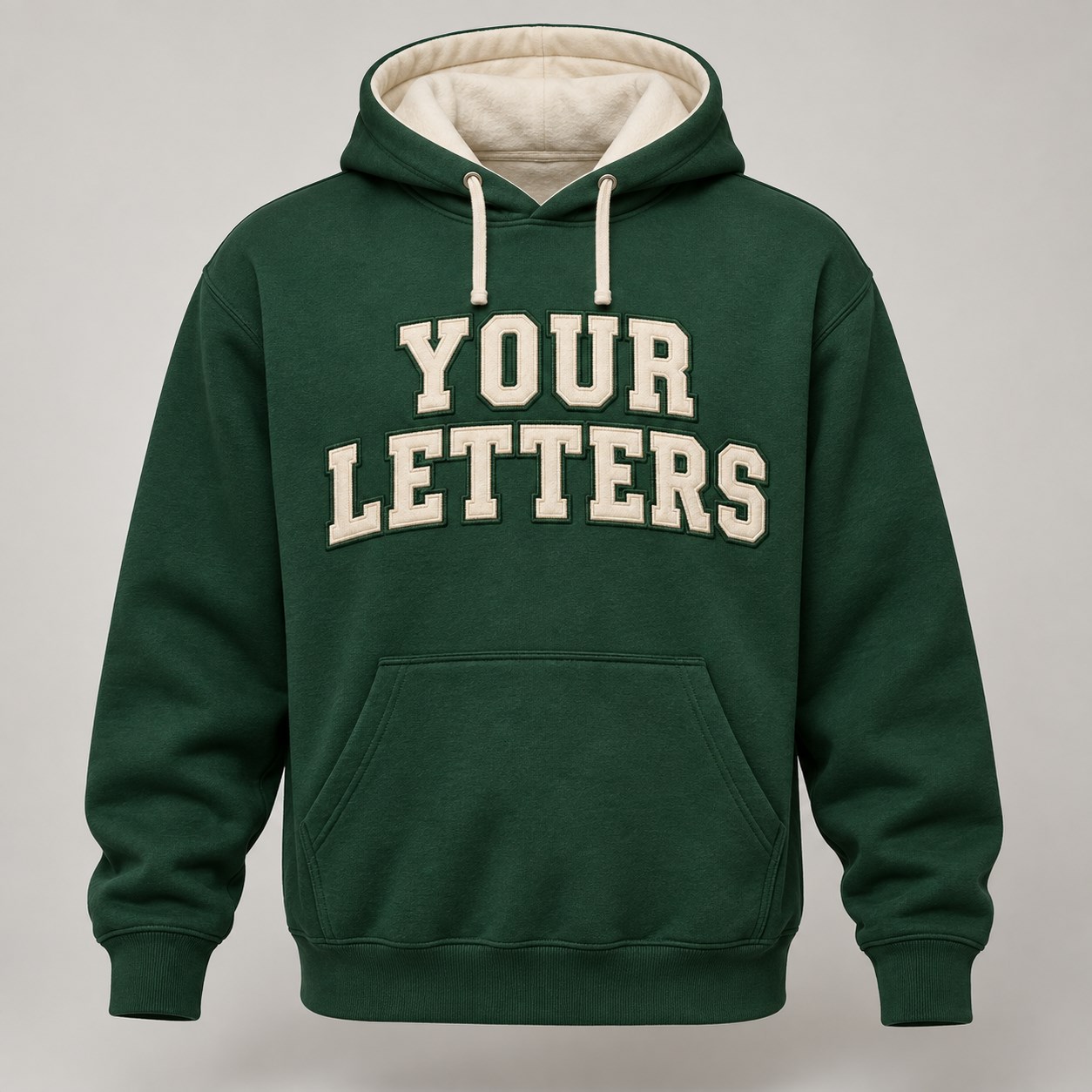 Green hoodie concept with cream YOUR LETTERS applique-style embroidered lettering